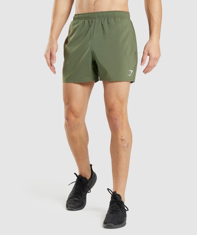 Bermudas Gymshark Arrival 5" Hombre Verde Oliva | cGNd2jv9I4I